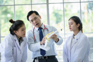 asian teacher teaching medical students
