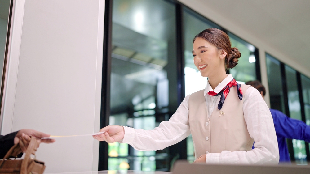 passenger giving passport to flight attendant, tourism